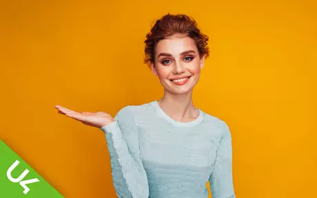 Smiling woman on orange background