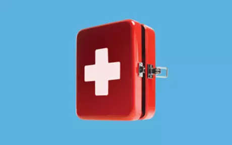 First aid kit on blue background