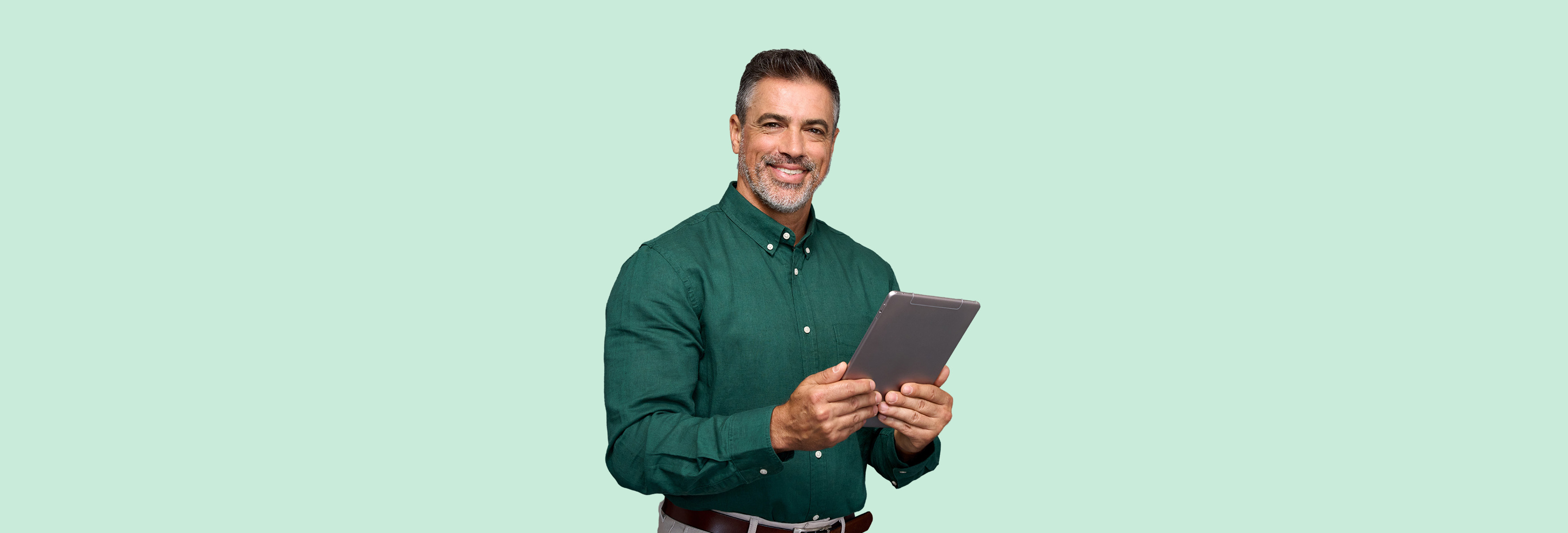 men with a tablet in his hands and smiling