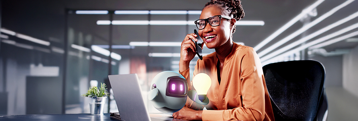 A professional is sitting at a desk with a laptop, conversing on the phone and interacting with an AI assistant in a modern office setting.