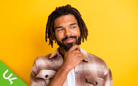 Smiling man on yellow background