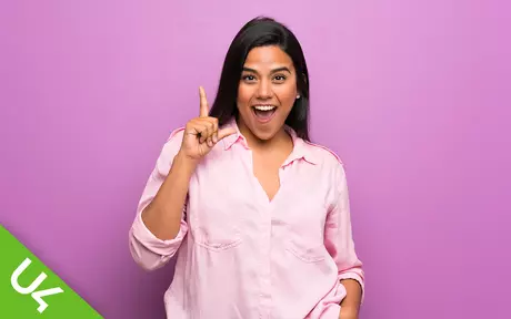 Laughing woman in light pink blouse