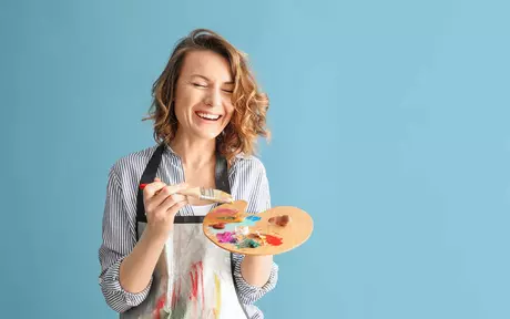 woman holding painting plate