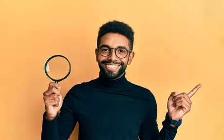 person with magnifying glass