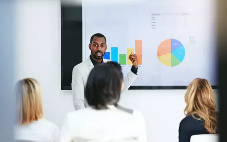 business people looking at presentation