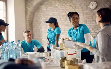 people working going through donations