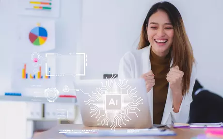 woman smiling for her laptop
