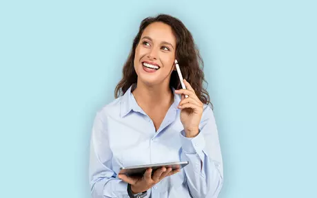 woman with a tablet in her hand smiling