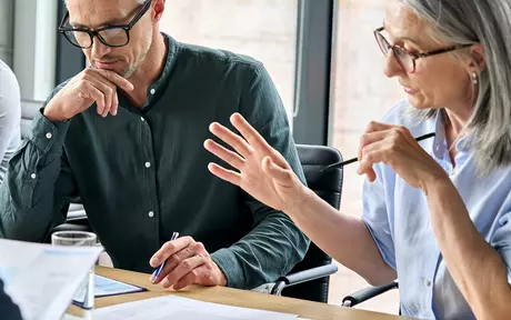 woman and men having a meeting