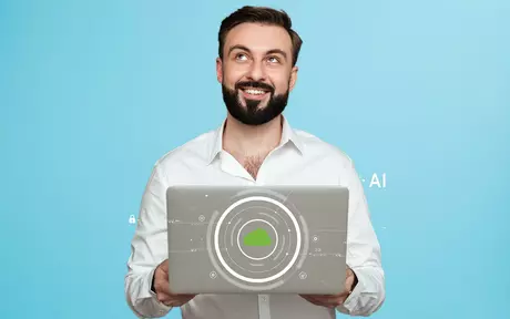 A man with a beard holds a laptop displaying a green cloud logo and tech graphics against a light blue background.
