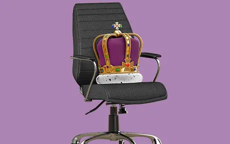 A black office chair with a purple and gold crown resting on the seat. 